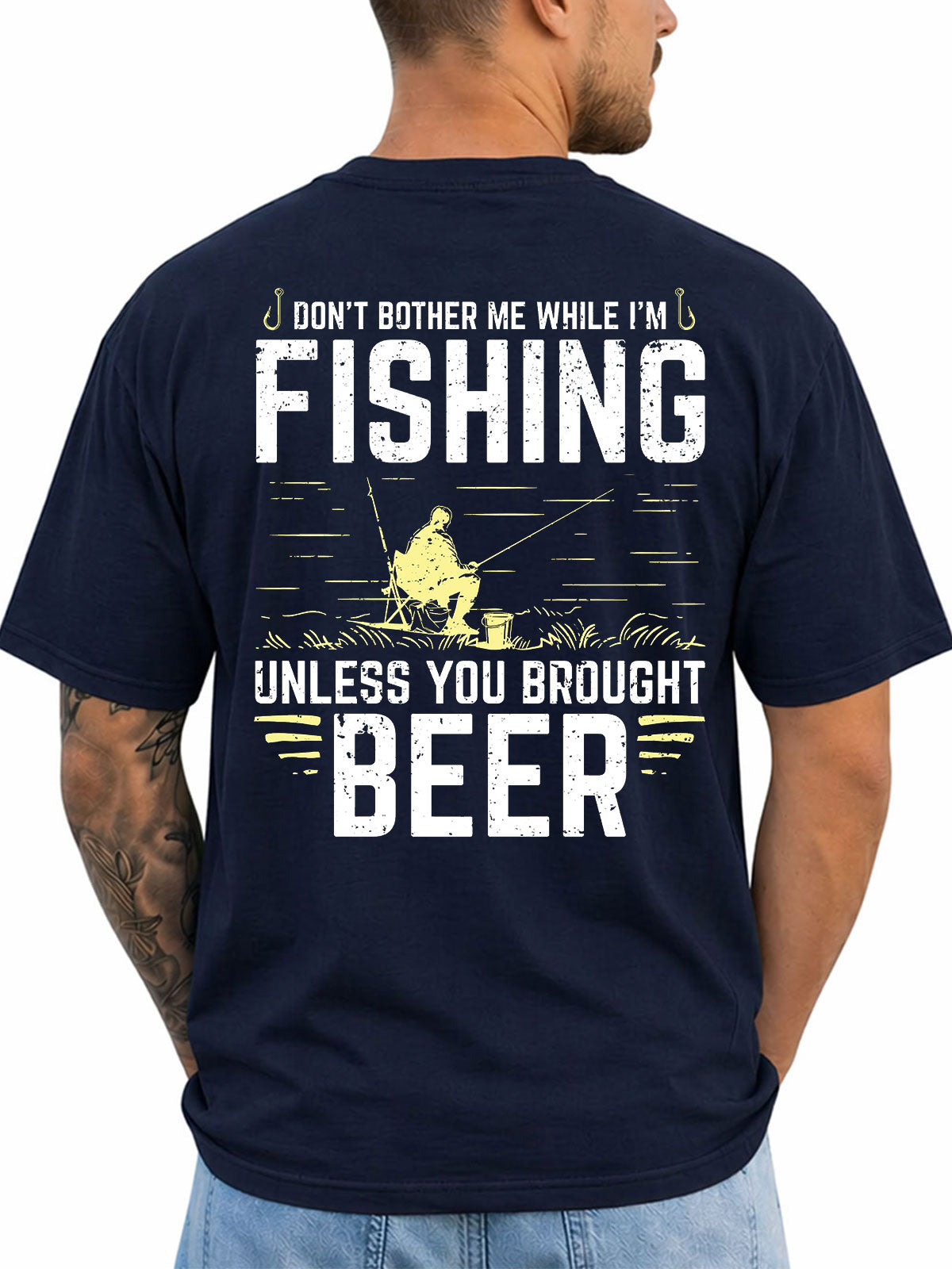 Navy T-shirt back with seated fisherman and vintage slogan graphic