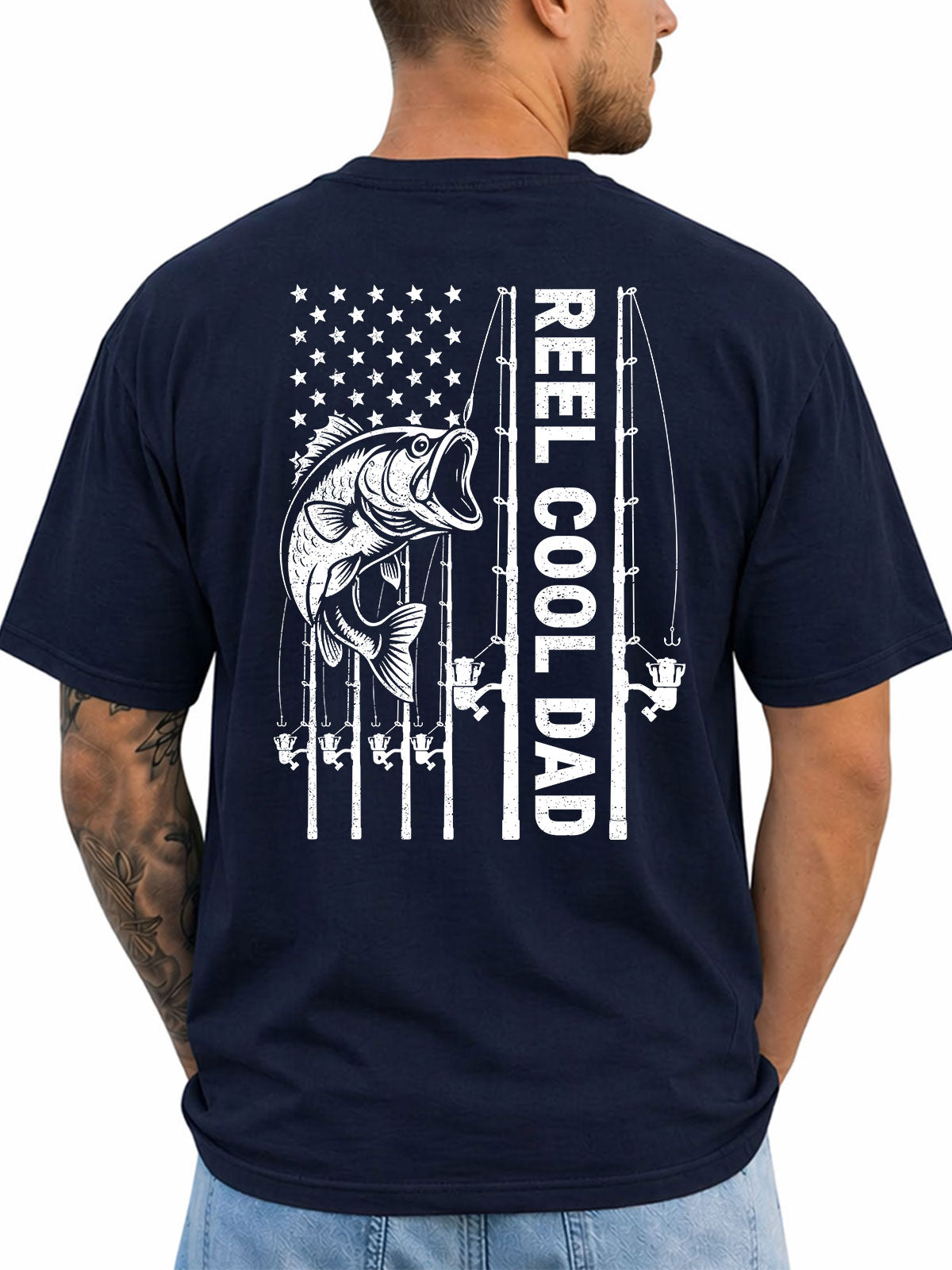 Navy T-shirt back with bass, fishing rods, and flag-inspired Reel Cool Dad graphic