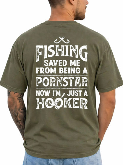 A man wearing an olive green t-shirt, viewed from the back. The shirt features a large white graphic text that reads 'FISHING SAVED ME FROM BEING A PORNSTAR NOW I'M JUST A HOOKER' with a fishing hook and line illustration at the top.