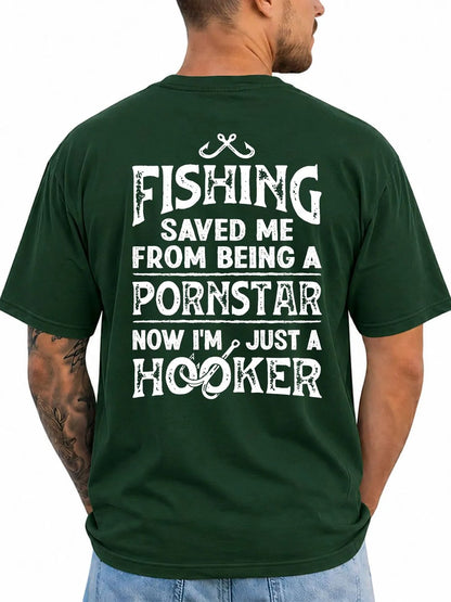 A man wearing a dark green t-shirt, viewed from the back. The shirt features a large white graphic text print that reads 'FISHING SAVED ME FROM BEING A PORNSTAR NOW I'M JUST A HOOKER' with a fishing hook and line design.