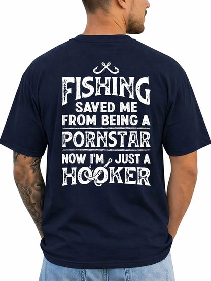 A man shown from the back wearing a navy blue t-shirt with a humorous white graphic text print that reads 'FISHING SAVED ME FROM BEING A PORNSTAR NOW I'M JUST A HOOKER' accompanied by fishing hooks and line illustrations.