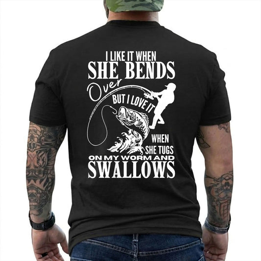 Black T-shirt back with woman silhouette, bent rod, fish, and adult fishing double-entendre back graphic reading 'I LIKE IT WHEN SHE BENDS OVER BUT I LOVE IT WHEN SHE TUGS ON MY WORM AND SWALLOWS'