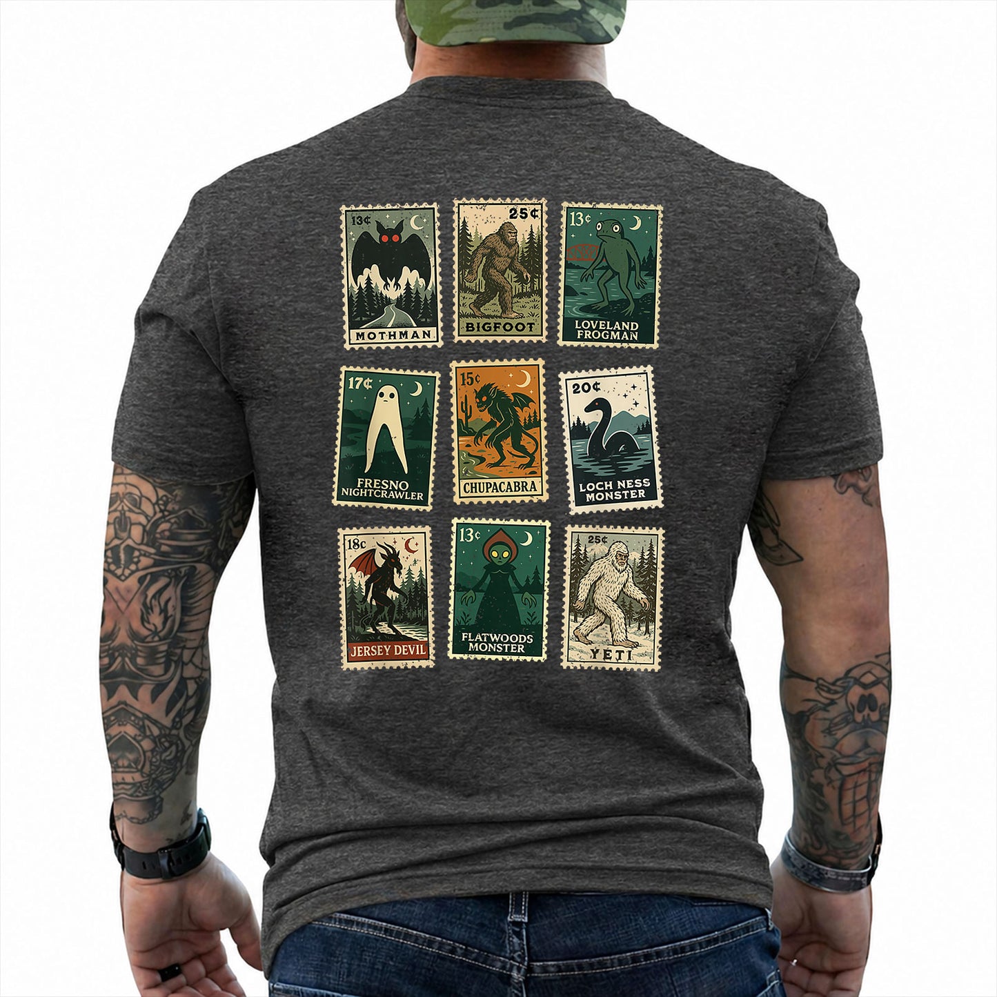 Dark Heather T-shirt back with nine vintage-style cryptid stamps featuring Mothman, Bigfoot, and other legendary creatures