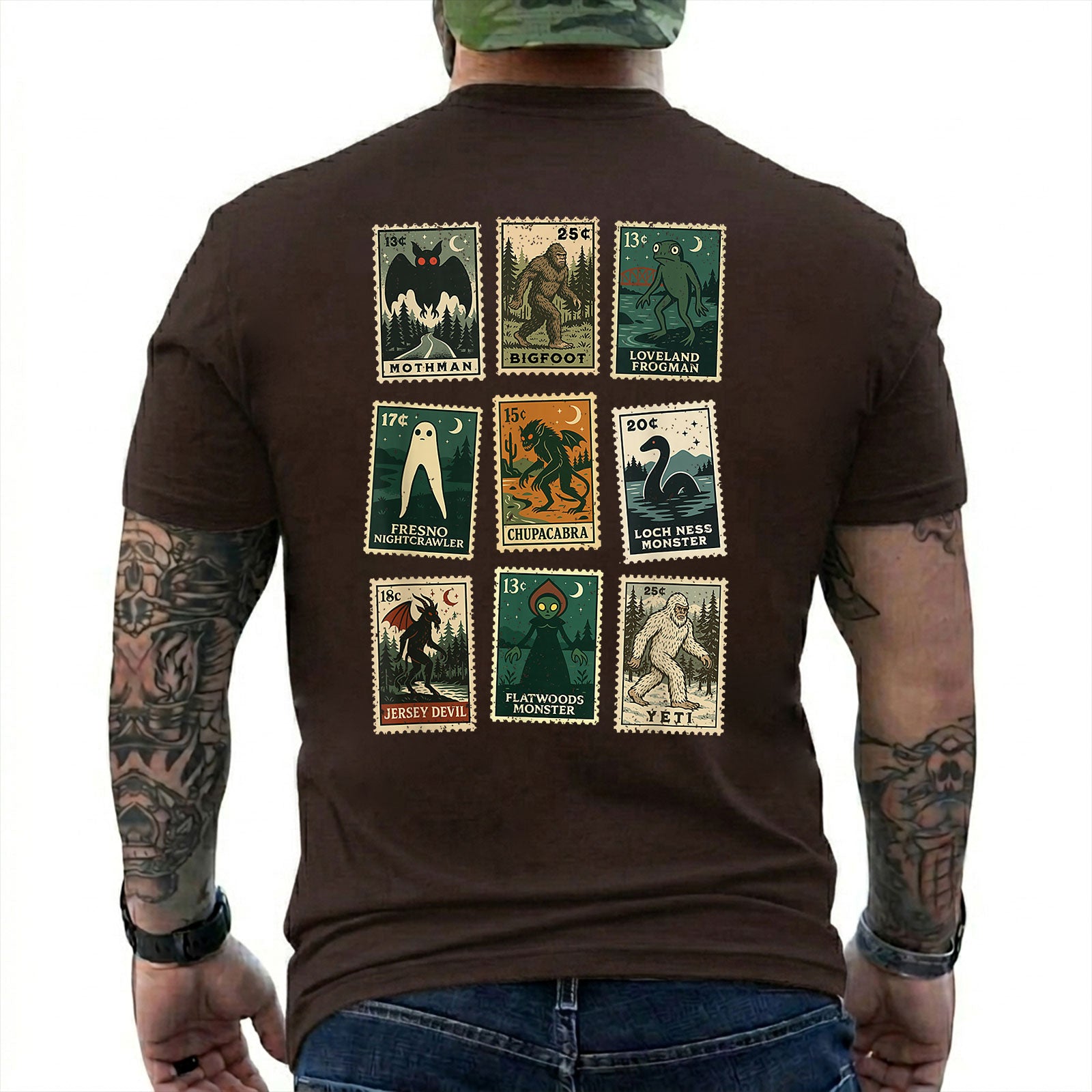 Dark Chocolate T-shirt back with nine vintage-style cryptid stamps featuring Mothman, Bigfoot, and other legendary creatures