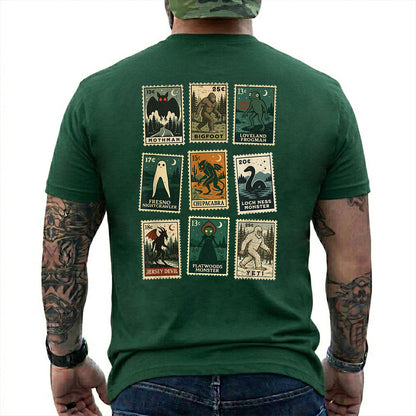 Forest Green T-shirt back with nine vintage-style cryptid stamps featuring Mothman, Bigfoot, and other legendary creatures