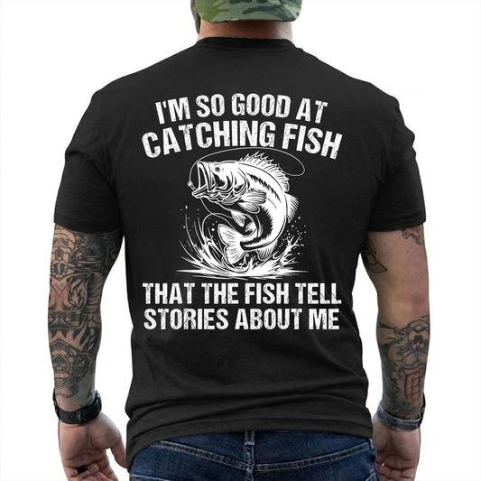 Black T-shirt back with splashing bass and distressed Fish Tell Stories back graphic reading 'I'M SO GOOD AT CATCHING FISH THAT THE FISH TELL STORIES ABOUT ME'