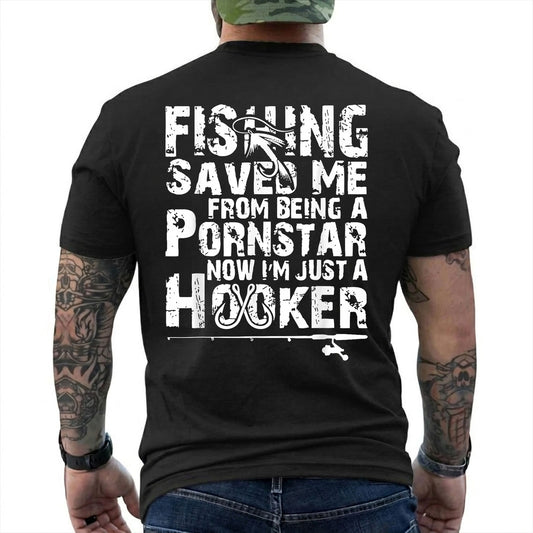 Black T-shirt back with oversized distressed type, hooks, and adult Fishing Saved Me back joke reading 'FISHING SAVED ME FROM BEING A PORNSTAR NOW I'M JUST A HOOKER'