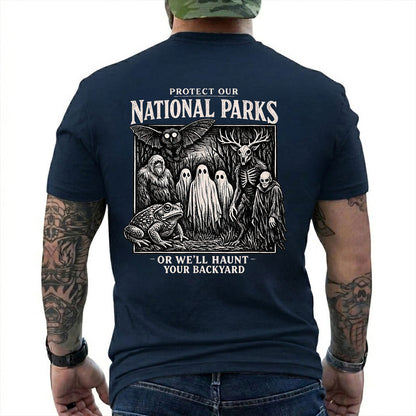 Navy T-shirt back with black-and-white cryptid collage with ghosts, Bigfoot, Mothman, a frog, and skeletal figures
