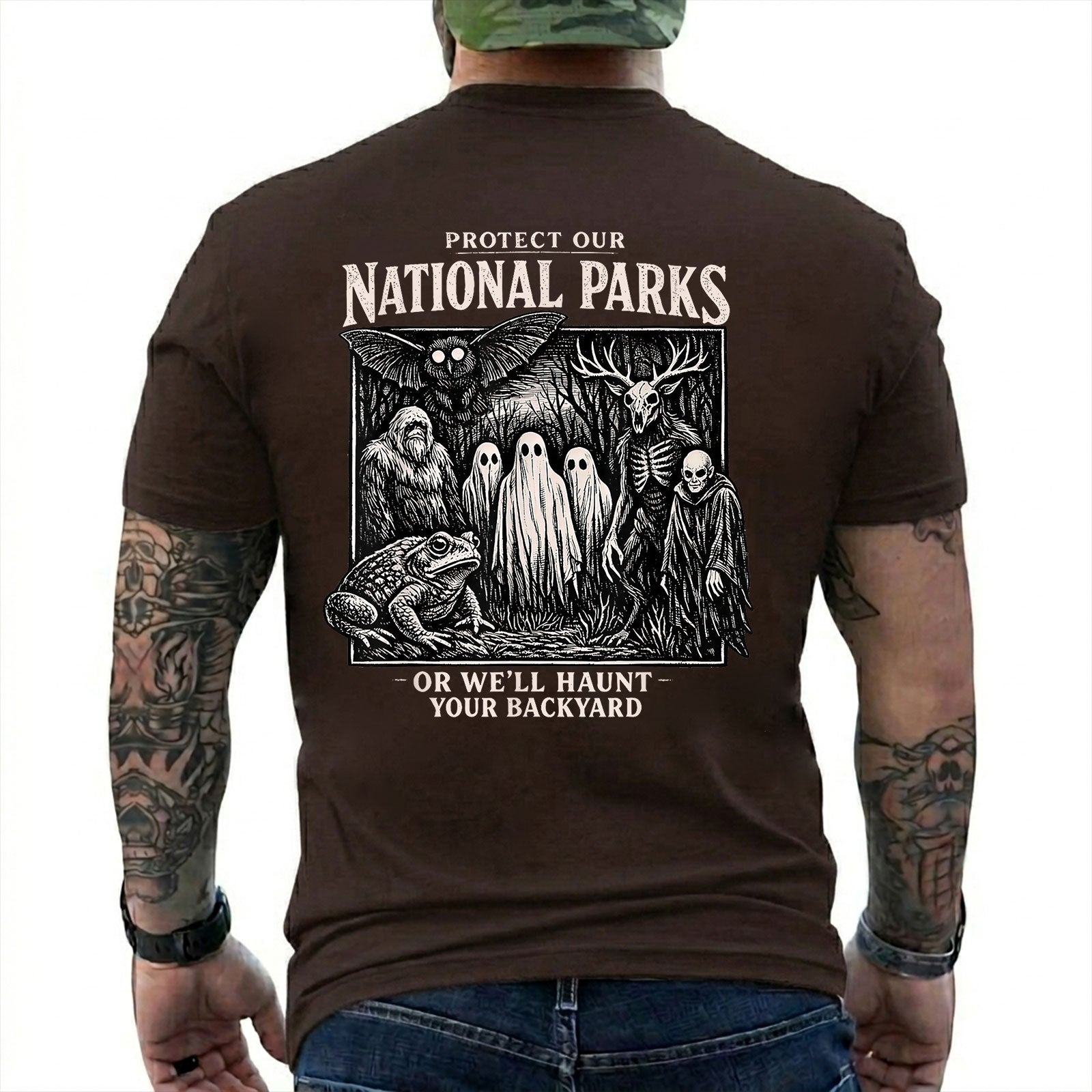 Dark Chocolate T-shirt back with black-and-white cryptid collage with ghosts, Bigfoot, Mothman, a frog, and skeletal figures