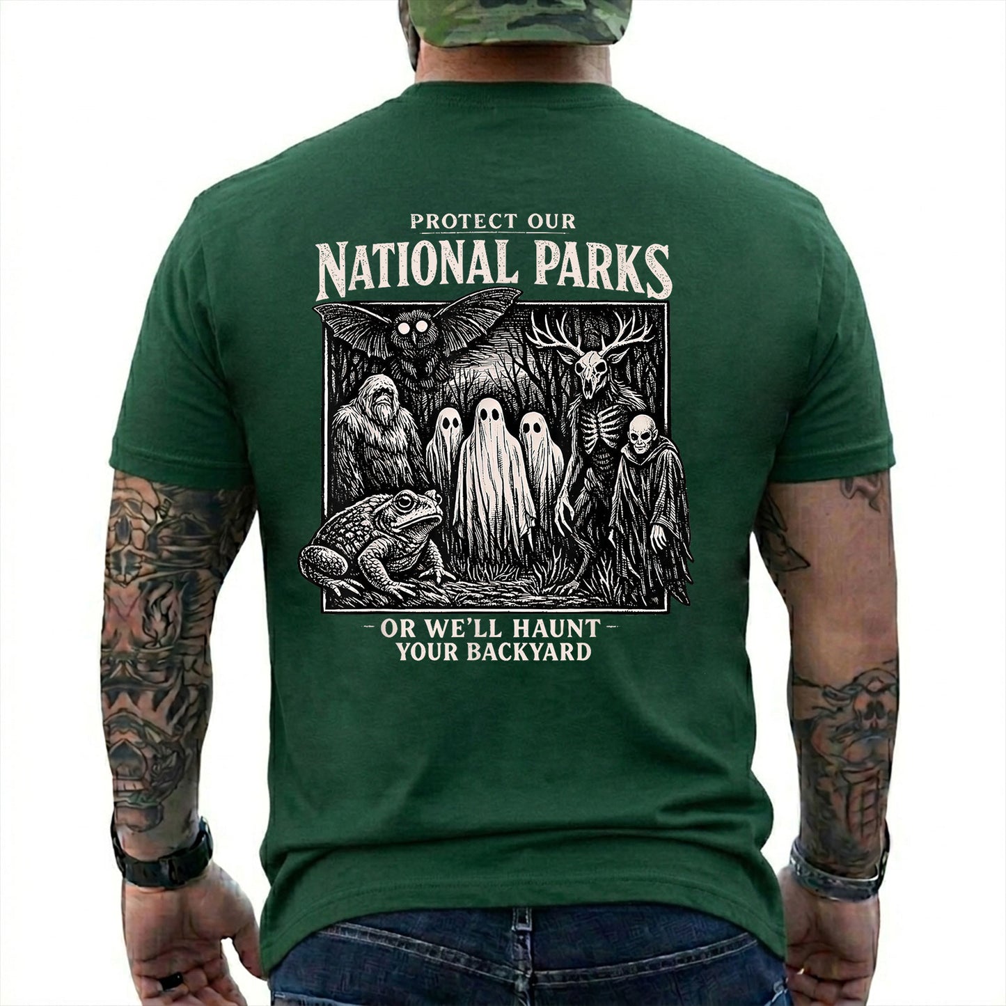 Forest Green T-shirt back with black-and-white cryptid collage with ghosts, Bigfoot, Mothman, a frog, and skeletal figures