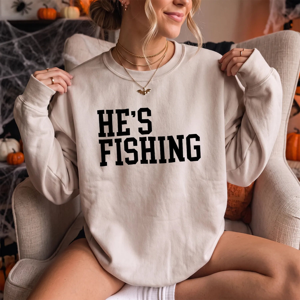 Hes Fishing Wife Humor Sweatshirt Women model in Sand
