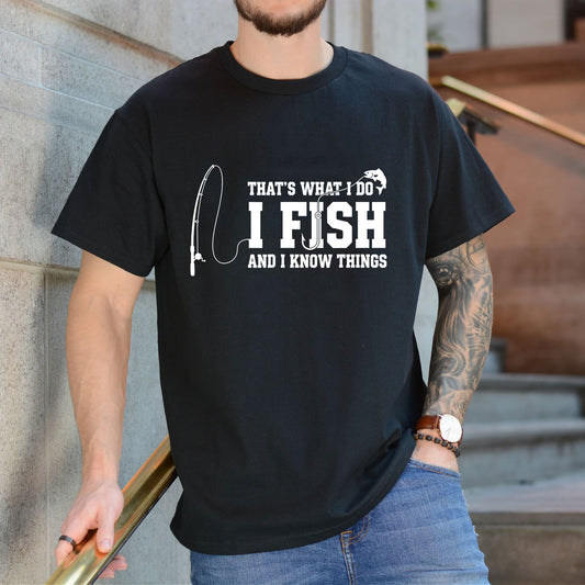 Black T-shirt front with fishing rod and I Fish and I Know Things front graphic reading 'THAT'S WHAT I DO I FISH AND I KNOW THINGS'