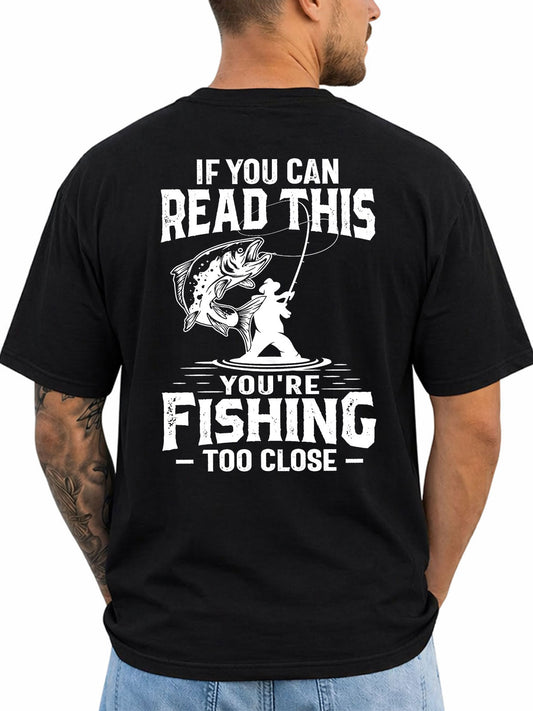 Black T-shirt back with distressed angler and leaping fish warning graphic reading 'IF YOU CAN READ THIS YOU'RE FISHING TOO CLOSE'