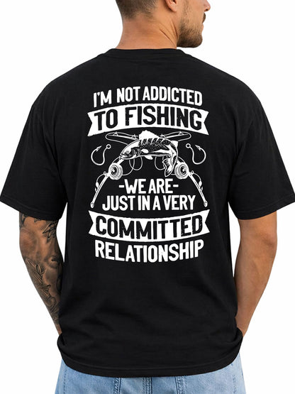Black T-shirt back with fish, rods, hooks, and committed-relationship fishing joke reading 'I'M NOT ADDICTED TO FISHING WE ARE JUST IN A VERY COMMITTED RELATIONSHIP'