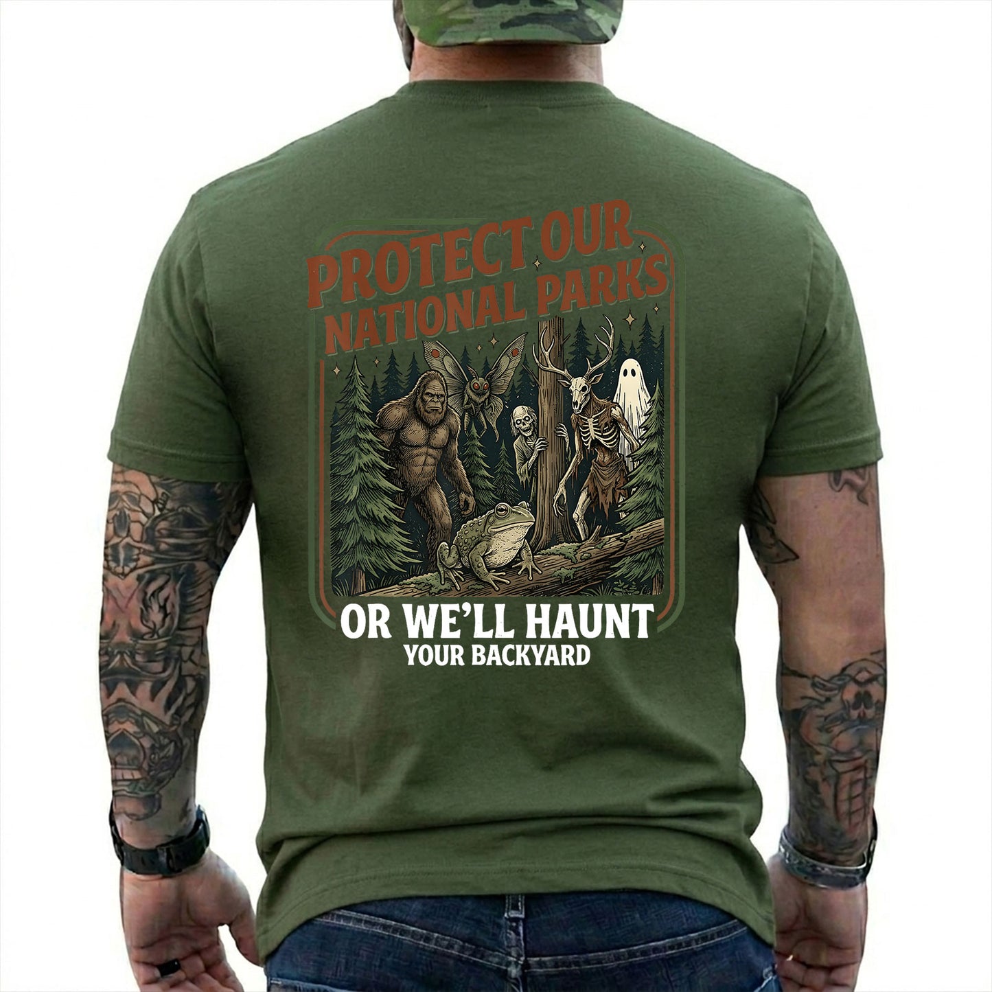 Military Green T-shirt back with color forest poster with Bigfoot, Mothman, a frog, ghosts, and a deer-skull creature