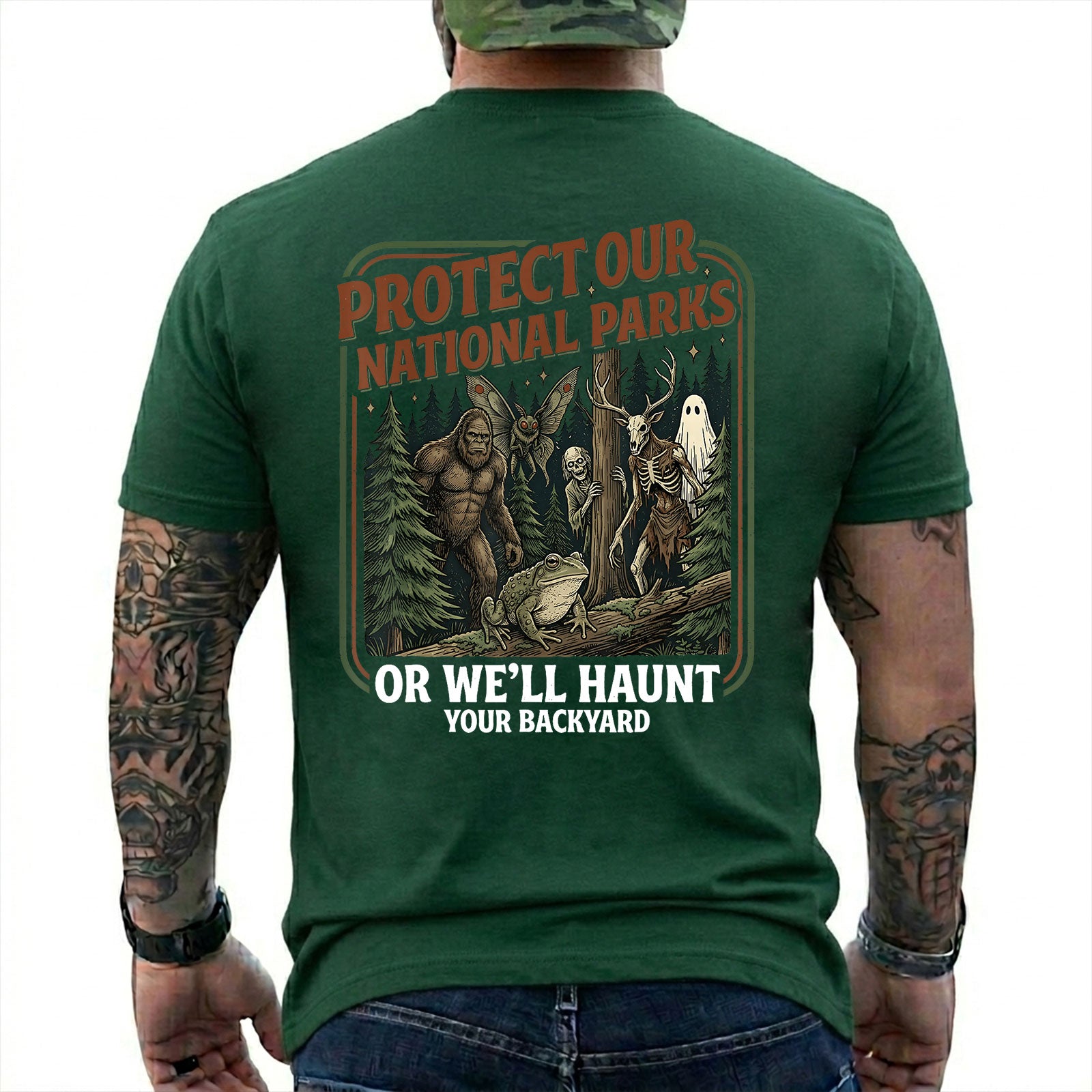 Forest Green T-shirt back with color forest poster with Bigfoot, Mothman, a frog, ghosts, and a deer-skull creature