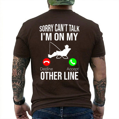Dark Chocolate T-shirt back with seated angler, fishing line, and phone-call Other Line joke