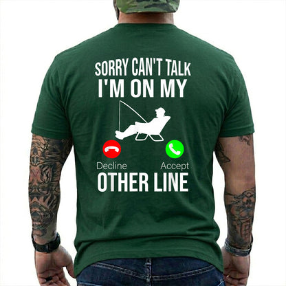 Navy T-shirt back with seated angler, fishing line, and phone-call Other Line joke