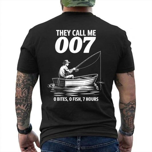 Black T-shirt back with angler in a small boat and 0 bites 0 fish 7 hours joke reading 'THEY CALL ME 007 0 BITES, 0 FISH, 7 HOURS'