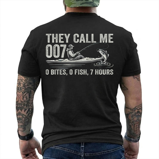 Black T-shirt back with kayak angler, jumping fish, and 0 bites 0 fish 7 hours joke reading 'THEY CALL ME 007 0 BITES, 0 FISH, 7 HOURS'