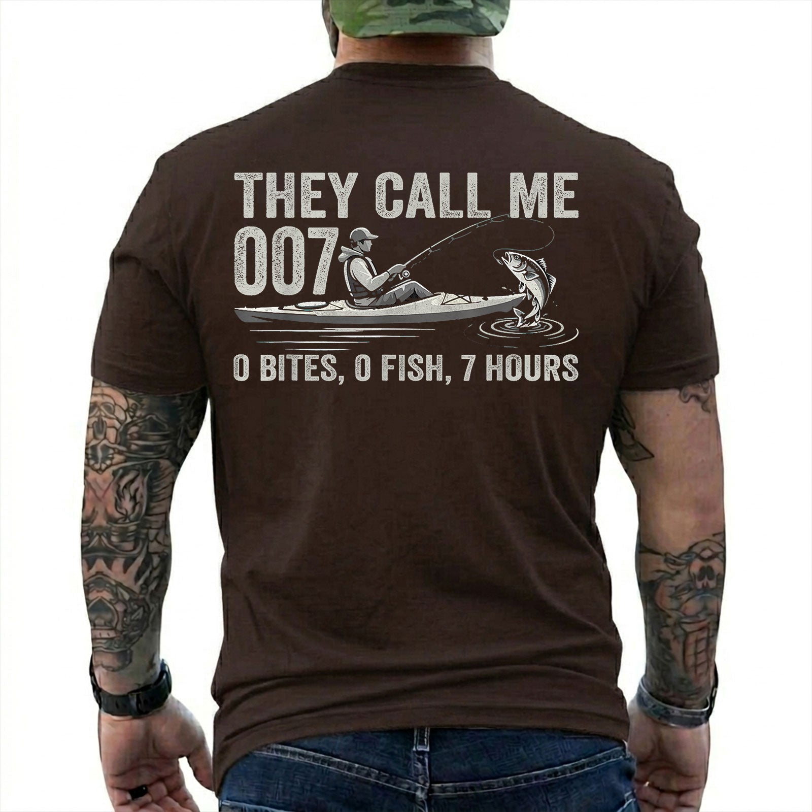 Dark Chocolate T-shirt back with kayak angler, jumping fish, and 0 bites 0 fish 7 hours joke