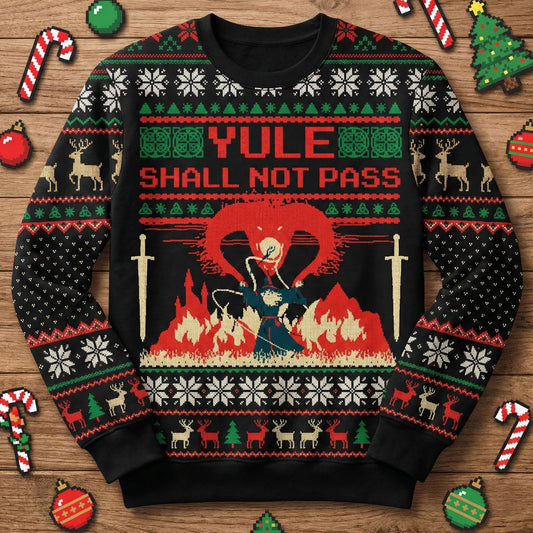 Front flat of a black sweater reading Yule Shall Not Pass above a pixel wizard and a fire creature