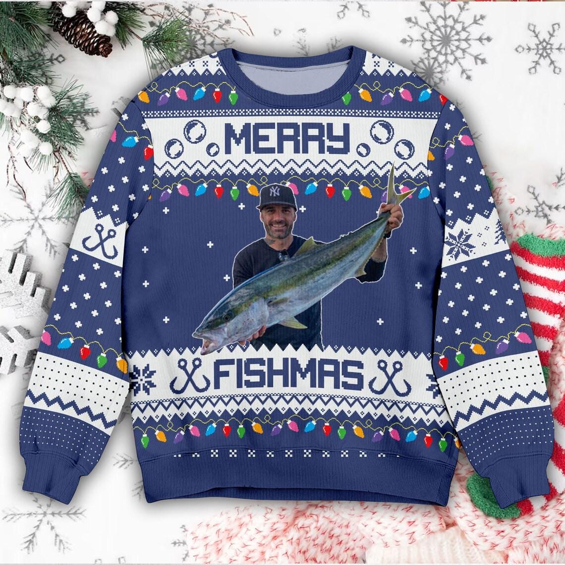 Navy Merry Fishmas sweater with a printed photo of an angler in a dark cap holding a fish