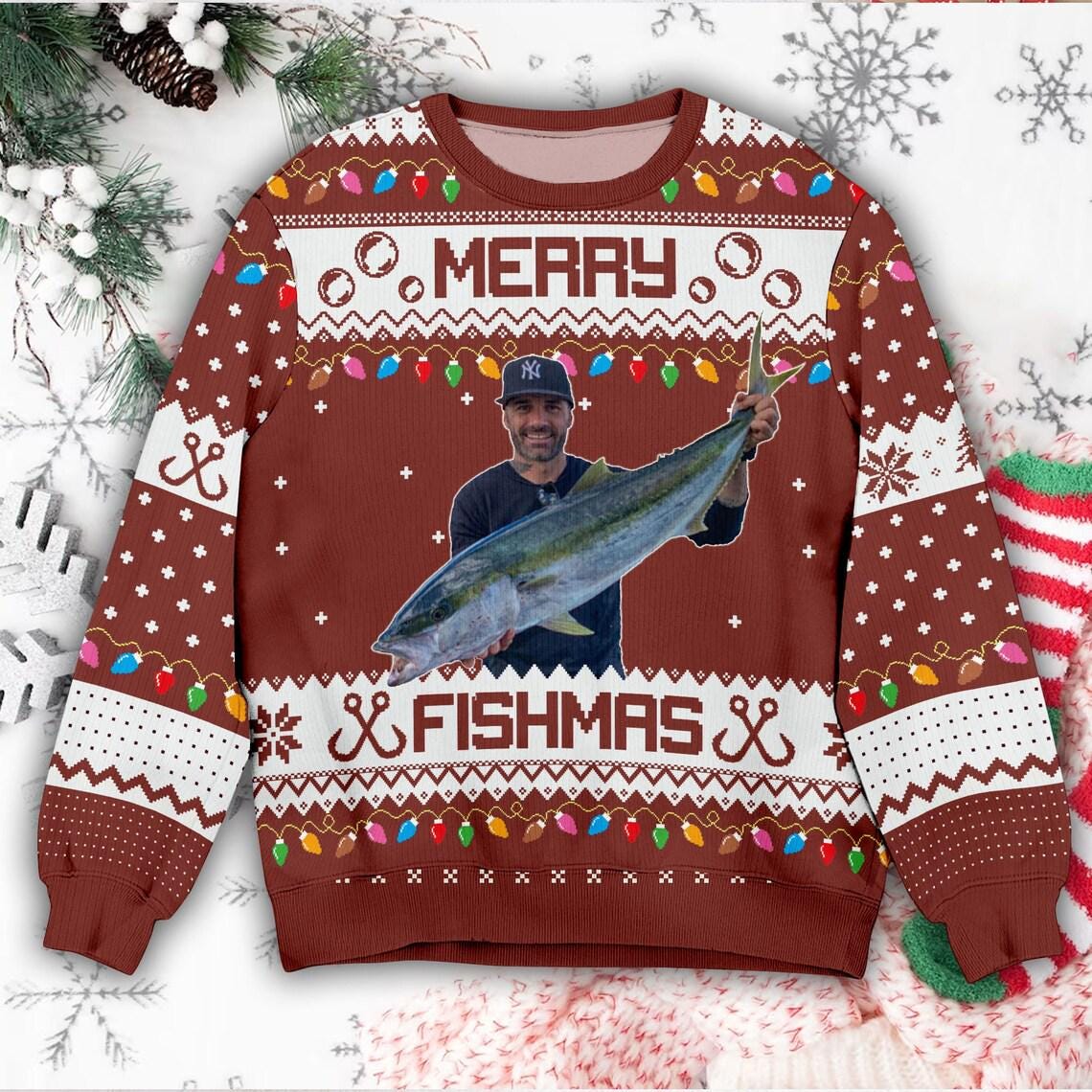 Brown Merry Fishmas sweater with the same angler photo between the two words