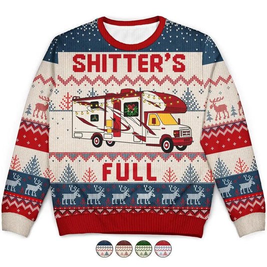 Flat of a holiday sweater reading Shitter's Full around a Class C motorhome