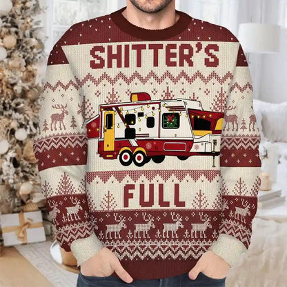 Man wearing a maroon Shitter's Full sweater with a travel trailer