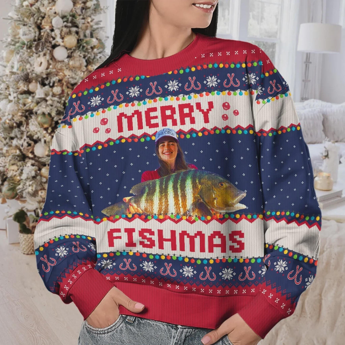 Woman wearing a navy Merry Fishmas sweater with a striped-fish photo