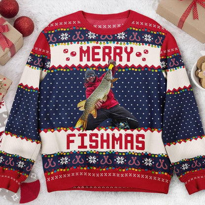 Navy Merry Fishmas sweater flat with an angler in a red jacket holding a pike