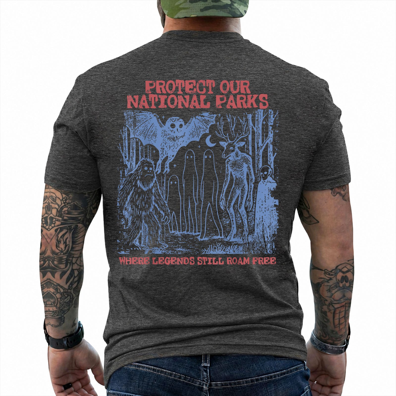 Dark Heather T-shirt back with blue forest cryptids beneath red Protect Our National Parks lettering