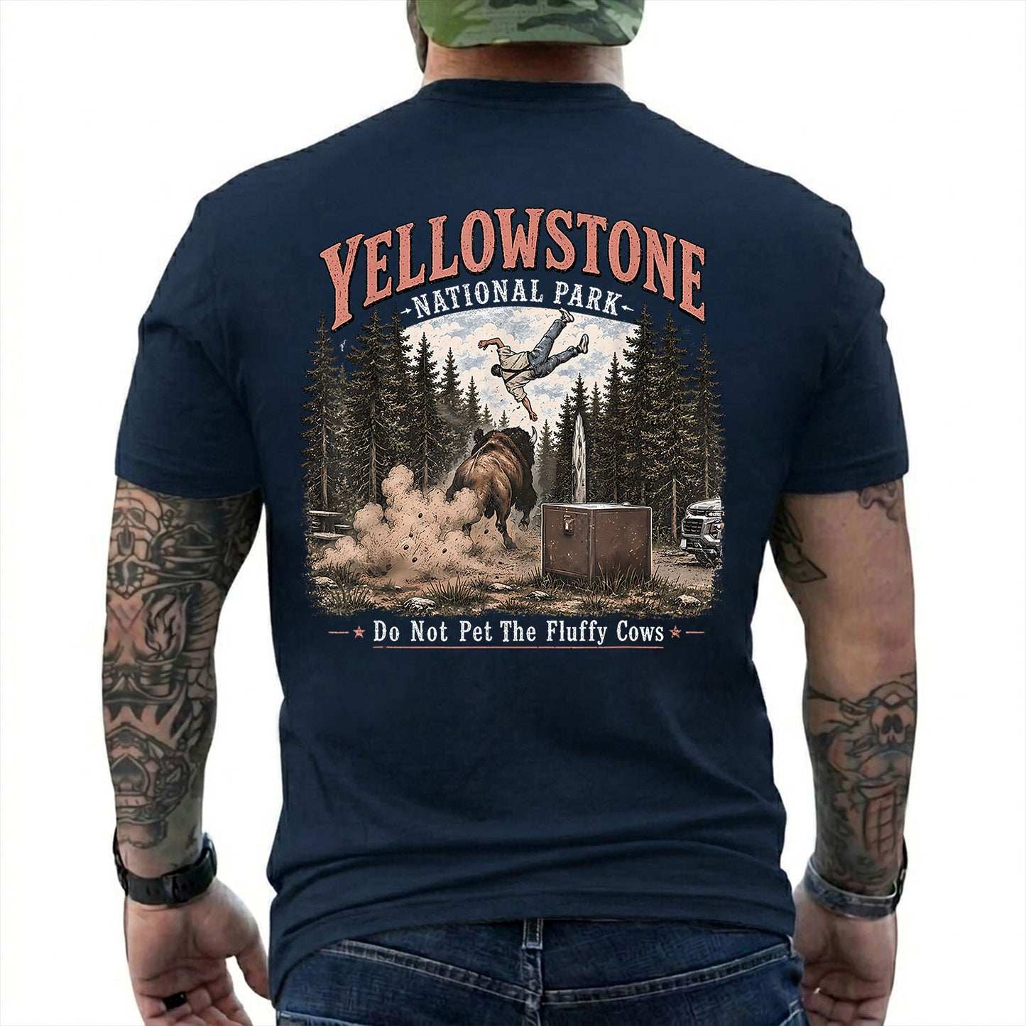 Navy T-shirt back with Yellowstone bison tossing a tourist beside Do Not Pet The Fluffy Cows text