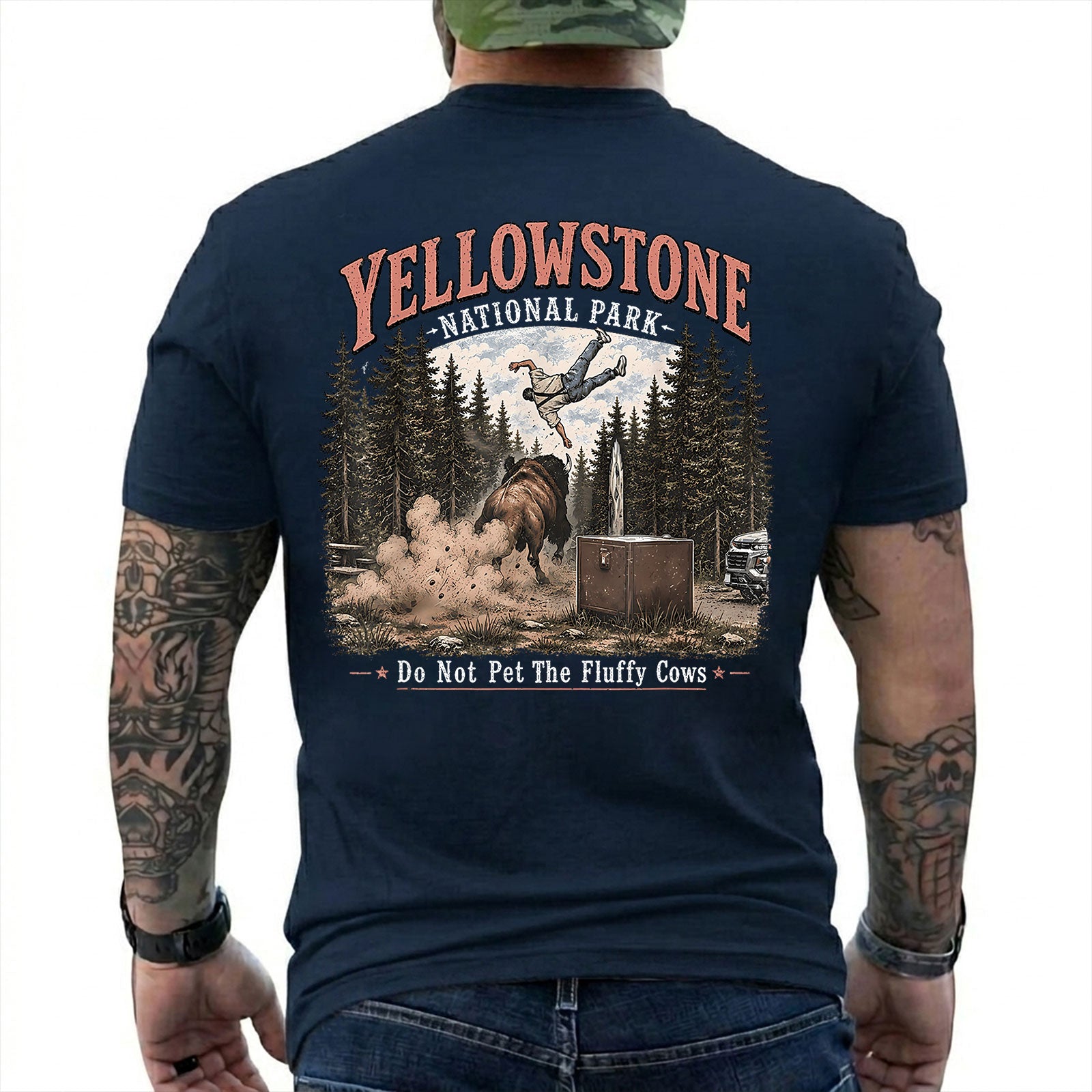 Navy T-shirt back with Yellowstone bison tossing a tourist beside Do Not Pet The Fluffy Cows text